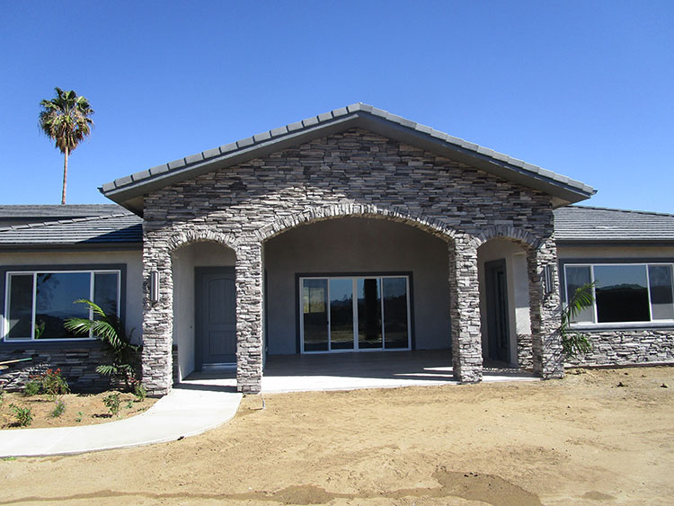 Stone veneer on the front of new custom home in Murrieta